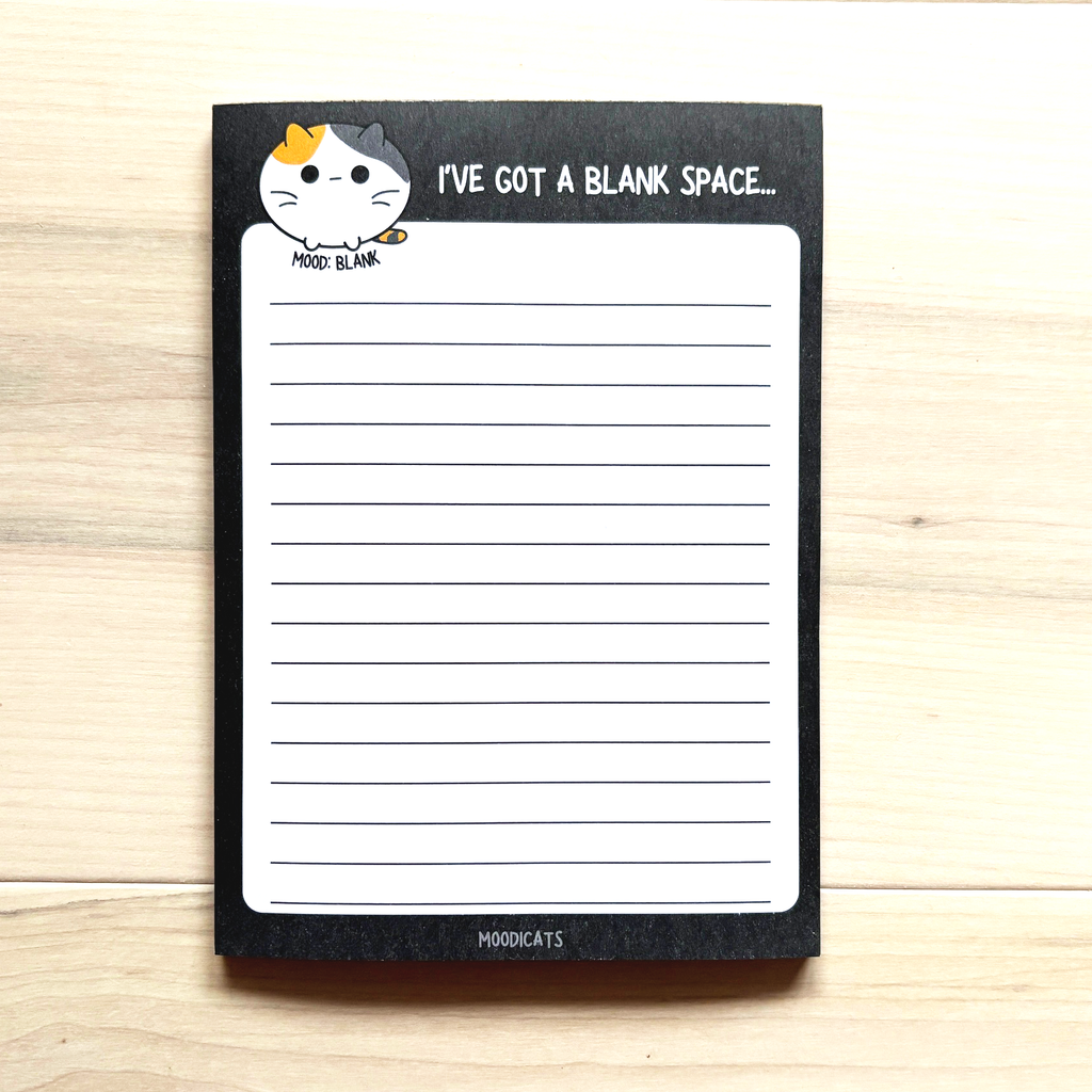 notepad with "I've got a blank space.." and illustrated cat with blank expression