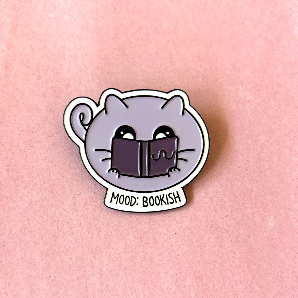enamel pin with mood bookish text